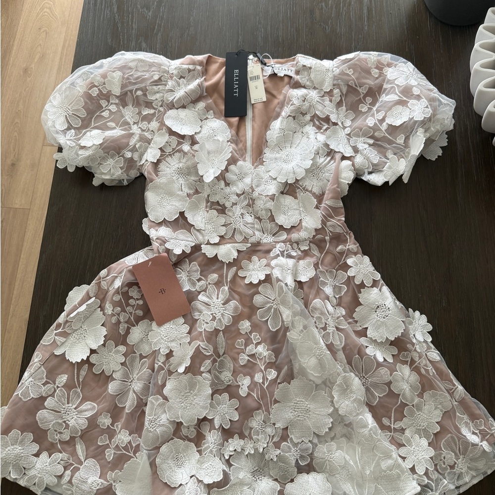 Elliatt Dress with White Floral Applique over nude dress